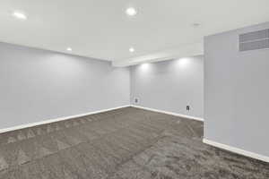 Basement featuring carpet flooring