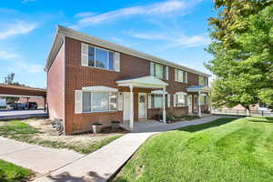 Multi unit property featuring a front yard