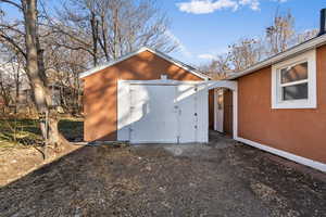 Exterior space featuring a storage shed