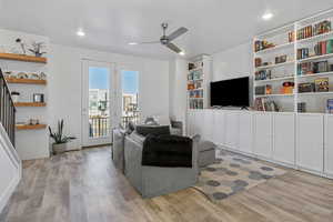 Living room featuring ceiling fan and LVP flooring