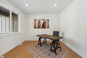 Office area featuring wood-type flooring