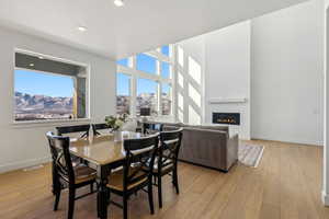 Dining space featuring light hardwood / wood-style floors and a mountain view