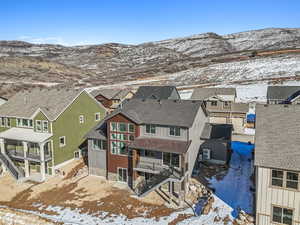 Snowy aerial view featuring a mountain view