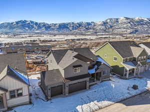 Snowy aerial view with a mountain view