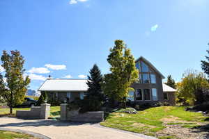 View of front of house with a front yard