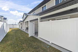 View of yard featuring central AC and a patio