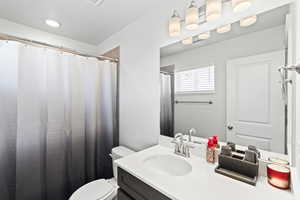 Bathroom featuring toilet and vanity