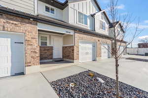 Doorway to property featuring a garage