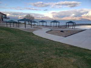 View of Marina Park across street from home with view of Utah Lake and Wasatch front mountains with gazebos in the park