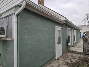 East Side of Home with Back Door Looking from the Backyard