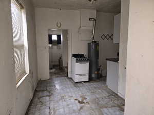 Looking Towards Kitchen with Gas Stove and Hot Water Heater