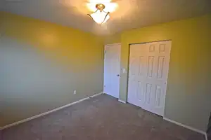 Master Bedroom. Unfurnished bedroom featuring a closet and dark colored carpet