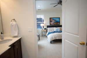 Bathroom with ceiling fan and vanity