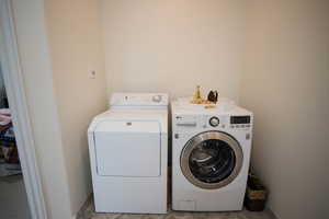 Washroom featuring washer and dryer