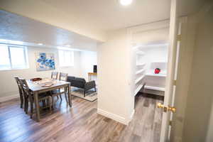 Dining space featuring a healthy amount of sunlight and hardwood / wood-style flooring