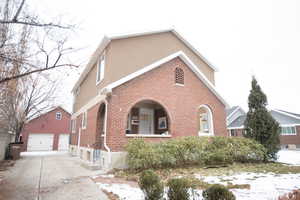 View of front facade featuring a garage