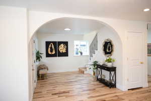 Corridor featuring light hardwood / wood-style flooring