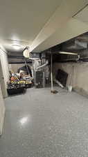 Basement featuring heating unit