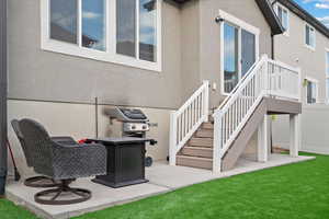 Rear view of house featuring a lawn