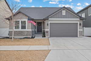 View of front facade featuring a garage