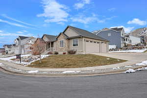 Front facade featuring a yard and a garage