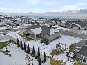 Snowy aerial view featuring a mountain view