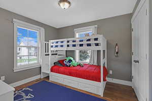 Bedroom featuring dark hardwood / wood-style floors