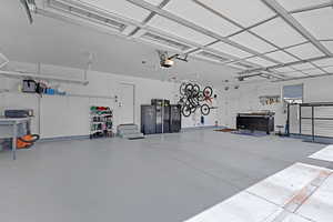 Garage with a workshop area and a garage door opener