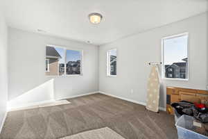 View of carpeted bedroom