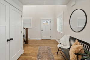 Foyer entrance with light hardwood / wood-style flooring