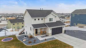 View of front of property with a front lawn and central AC