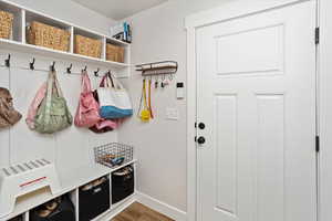 Mudroom with hardwood / wood-style flooring