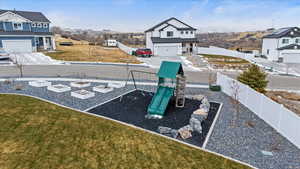 View of playground with a yard