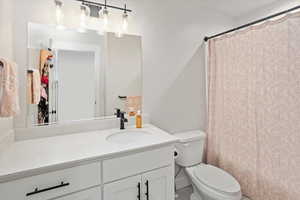 Bathroom featuring toilet and vanity