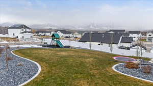 View of yard featuring a mountain view and a playground