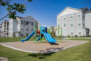 View of play area with a yard