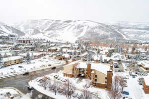 Snowy aerial view with a mountain view