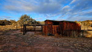 View of outbuilding featuring a rural view