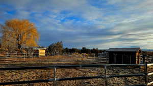 View of yard featuring an outbuilding and a rural view