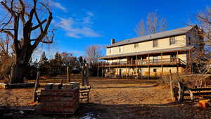 Back of house featuring a deck