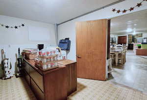 Office area featuring a textured ceiling