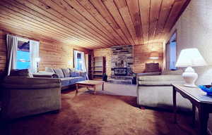 Living room with wooden ceiling and carpet flooring