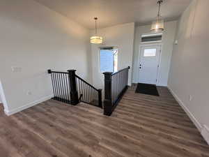 Foyer entrance featuring dark wood-type flooring