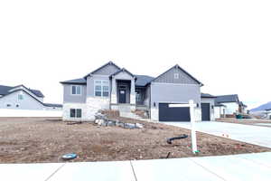 View of front of home featuring a garage