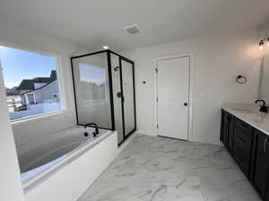 Bathroom with separate shower and tub and vanity