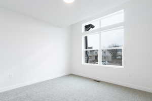 Unfurnished room with carpet flooring