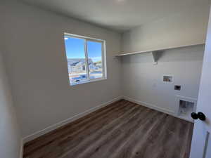 Clothes washing area featuring washer hookup, dark hardwood / wood-style floors, and hookup for an electric dryer