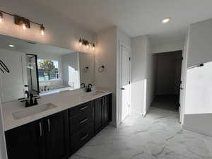 Bathroom featuring a bathtub and vanity