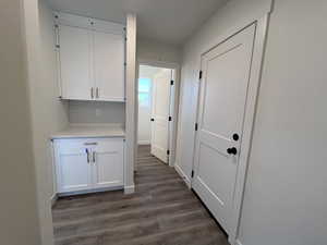 Hall with dark wood-type flooring