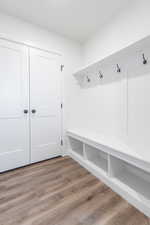 Mudroom with hardwood / wood-style flooring